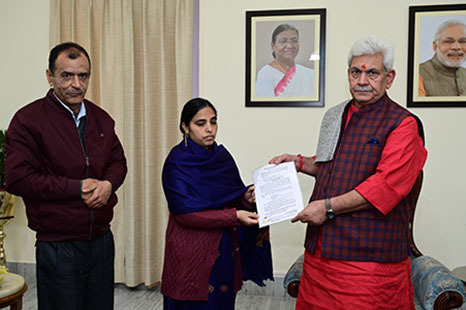 Lt Governor hands over appointment letter to martyr civilian Puran Krishan Bhat’s wife