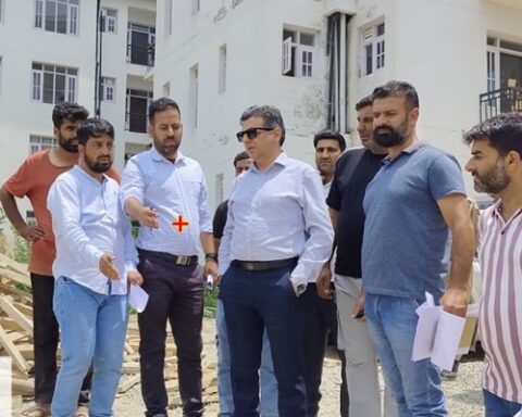 Dr Karwani inspects construction work on transit accommodations for PM Package Employees